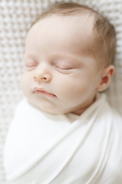 Newborn sleeping in photo session with Caroline Eidson 