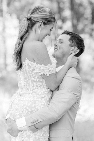 Newlyweds Mark and Emily underneath Carrigan Farms' willow tree captured by Charlotte NC wedding photographer