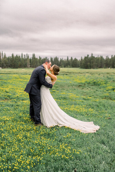 Rainy bride and groom veil kiss at Silverado Resort in Napa Valley, CA