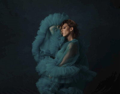 Stylized Portrait of lady in teal tulle.