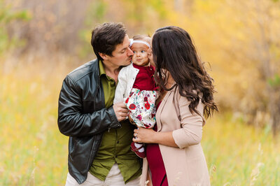 Fall photograph of a family with a baby