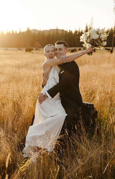 bride and groom smiling at golden hour in lake tahoe
