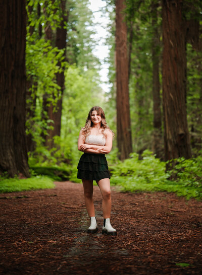 A Fortuna High Senior poses in the redwoods near Jordan Creek.