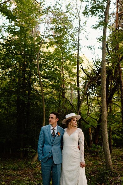 bride and groom in a forest during their elopement