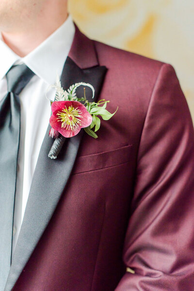 burgundy groom jacket with maroon flower