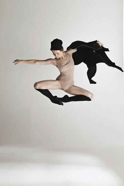 young-beautiful-dancer-in-beige-swimsuit-dancing-PYP86QW