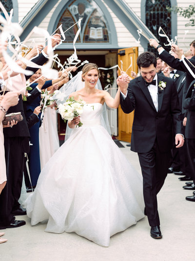 We love a great grand exit, especially when the backdrop is a cute little chapel.