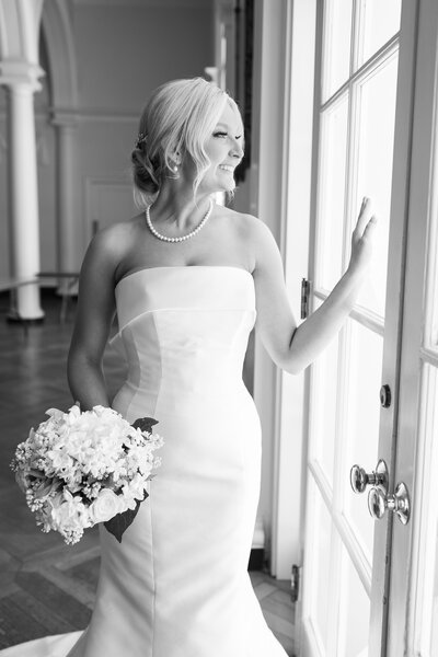 a bride looking at her wedding dress