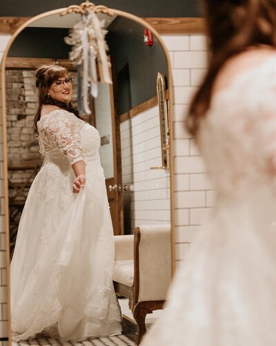 Bride Looking In Mirror At Kansas Wedding Venue