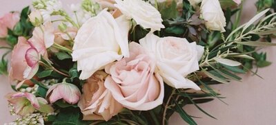 Blush and white roses for wedding arrangement.