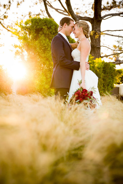 Tom Ham's Lighthouse wedding photos couple embracing at sunset