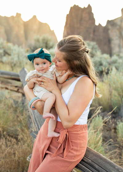 Mom and infant at sunset photographed by Portland Oregon family photoographer