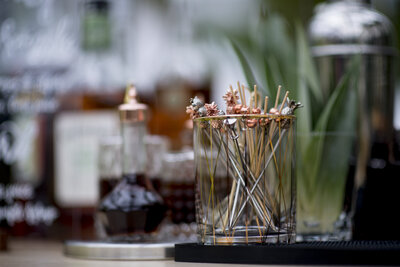 Stirrers/toothpicks in a small glass jar