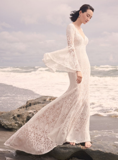 Long Sleeve Sheath Wedding Dress. Heads up, this romantic long-sleeved sheath wedding dress pairs impeccably with a flower crown. Moving forward, you must be willing to achieve poster-child status for all things bright, beautiful, and boho.