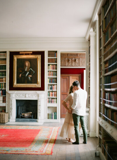 Couple kissing in beautiful old library in Los Angeles