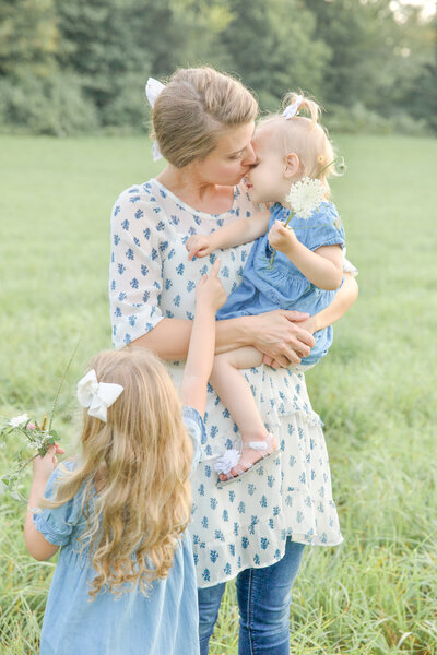 Mother interacting with her babies at a family photo session in mount vernon ohio