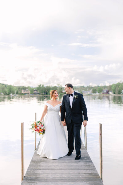 Outdoor wedding portraits on a dock on the water