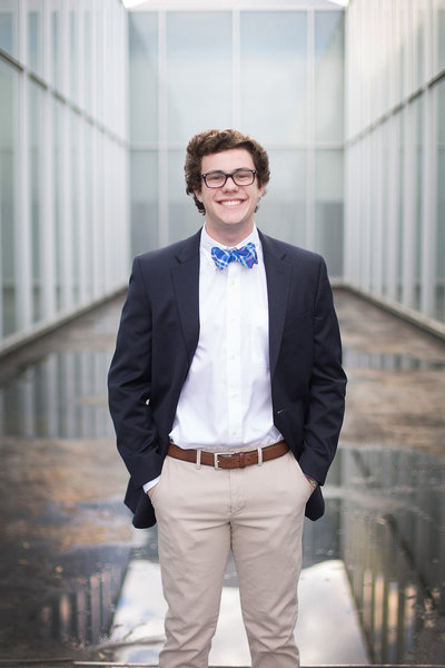 High school senior boy in sport coat and blue bow tie