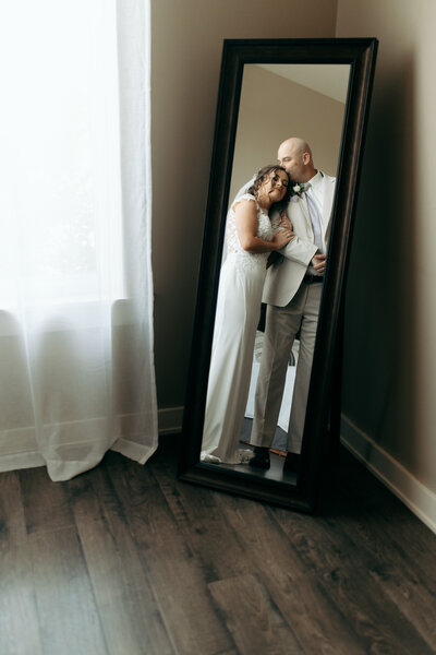 Bride and Groom Portraits in mirror St Catherine of Siena Wedding  | The Axmanns