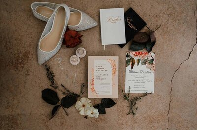 Wedding stationery suite and shoes flat lay