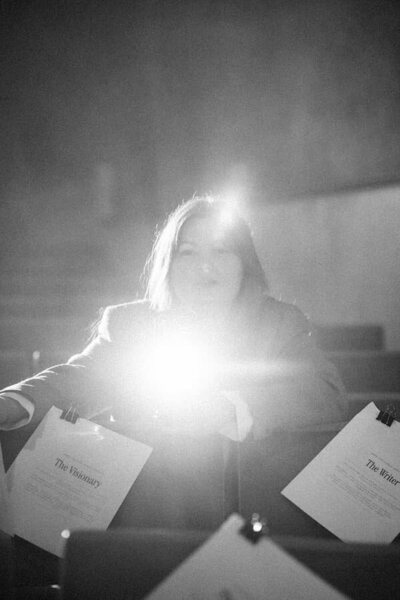 Morgan Michelle portrait Black and white portrait of Morgan Michelle holding an award in a dramatic light, business strategist and digital product educator