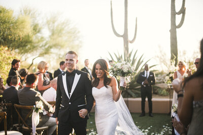 Lauren + Andrew's Four Seasons Scottsdale wedding was made beautiful with the help of these vendors: Some Like it Classic, Flowers by Jodi, Dolce & Gabbana,