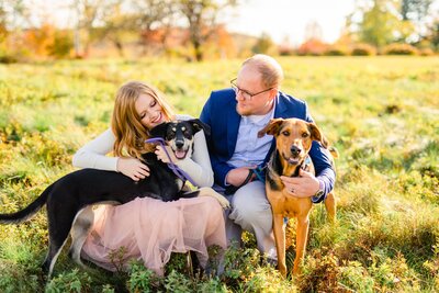 New England Area Wedding Photographers holding dogs