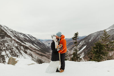 Groom carrying brides dress at new haven connecticut wedding 