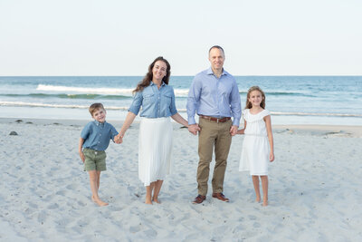 Family of four on the beach in Wells Maine
