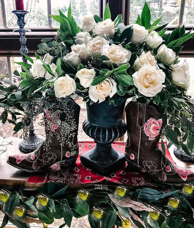 white roses with cowboy props