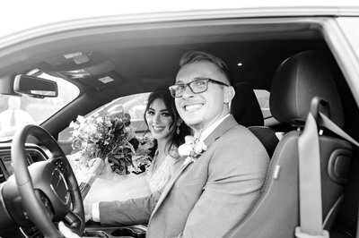bride and groom in getaway car in Lincoln, NE