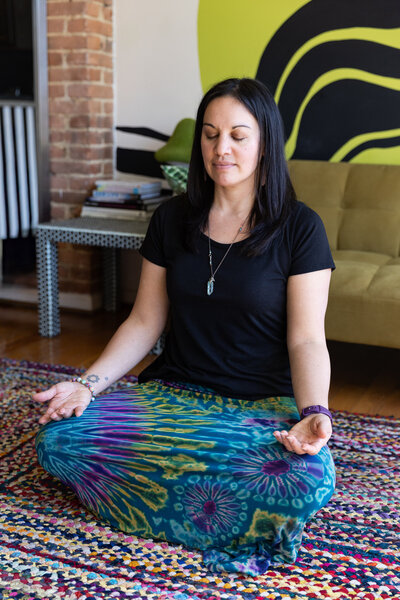 A-woman-owned-business-entrepreneur-meditates-during-her-artistic-creative-brand-photos-with-photographer-ingrid-berrios