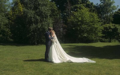 Timeless beauty of a stylish bride, gracefully posing in her gown, embodying elegance and sophistication in a dreamy wedding atmosphere
