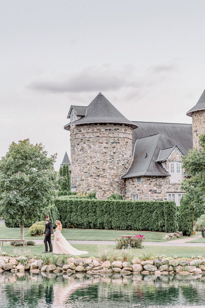 bride and groom in front of castle in northern michigan