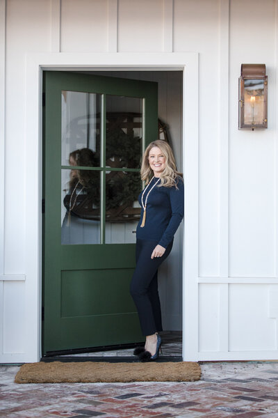 Interior designer Courtney Smith at front door entrance in Tiburon, CA