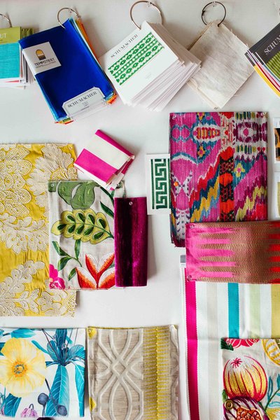 A color flat lay of patterned textiles and fabrics.