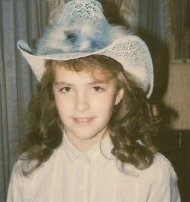 April Budney with rodeo hat 1986 Kansas City Missouri in her parent's home. 