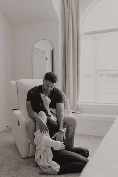 At-home Maternity Session in Oklahoma.  Pregnant mother looking lovingly towards her partner