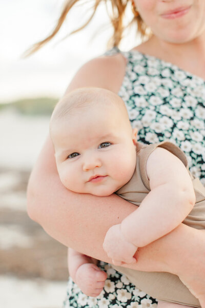 Closeup up of a mom holding her young boy during their photoshoot with beach photographer M. Lauren Photography