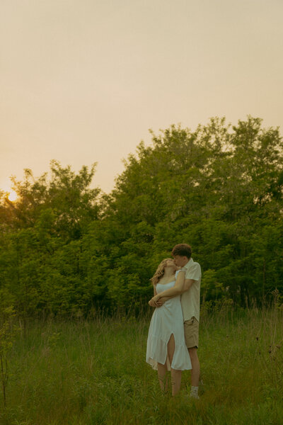 Newlyweds hold hands and run out of the church together, surrounded by streamers and loved ones