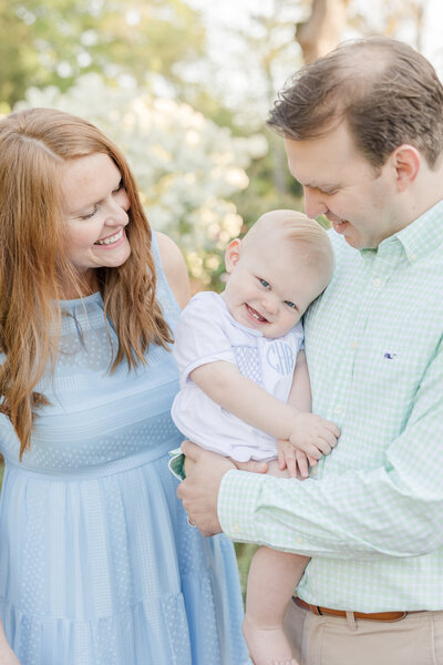 Baby smiling while his parents look down at him -Family Photographer Greenville SC