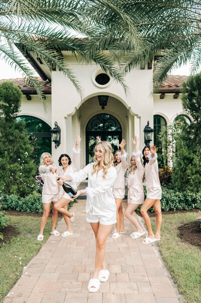Palm Beach Wedding Photographer captures bride celebrating with her bridesmaids