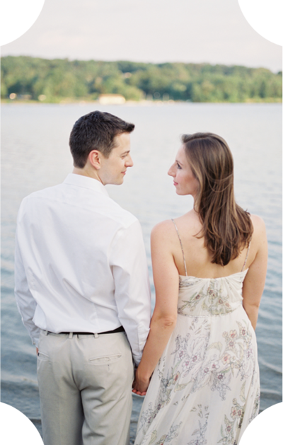engaged couple gazing lovingly at each other during their lakeside Pennsylvania engagement session
