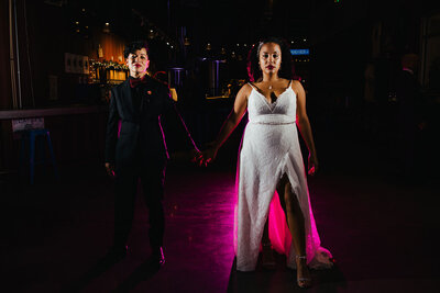 Two Brides holding hands night portrait Brewery Wedding Atlanta, GA