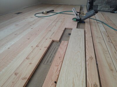 hardwood flooring in the process of being installed
