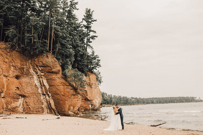 Couple shares an intimate dance on the beach in Wisconsin.