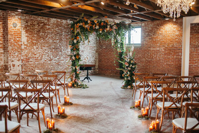 Timeless, exposed brick walls as a ceremony backdrop