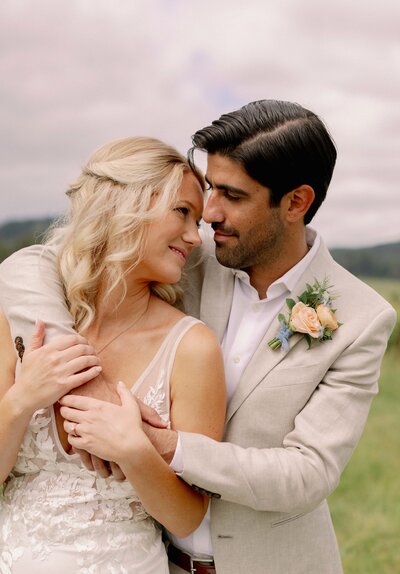 Couple Embracing in Vineyard - Marilee & Andrew | At the Joy Salem Oregon Wedding