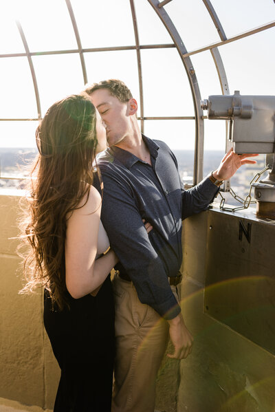 Couple kissing on the Foshay Tower Observation Deck