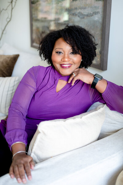 Black woman lounging in home branding photo